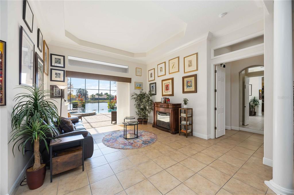 14806 Bowfin Terrace Lakewood Ranch, FL 34202 - Photo 12 of 95 a living room with furniture and a potted plant