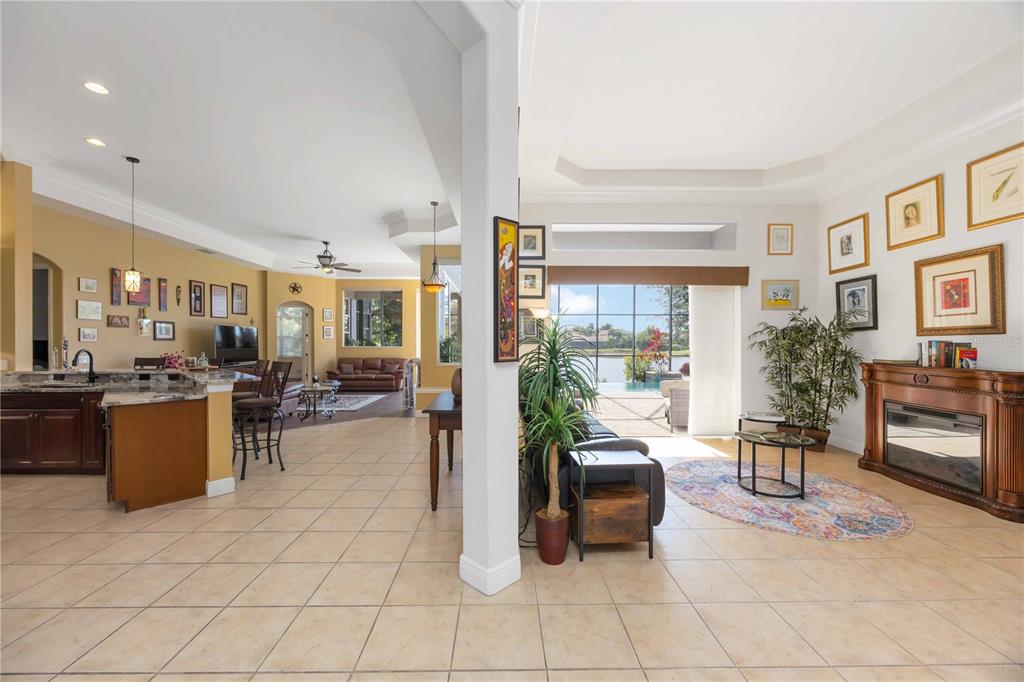 14806 Bowfin Terrace Lakewood Ranch, FL 34202 - Photo 19 of 95 a living room with furniture a large window and a table