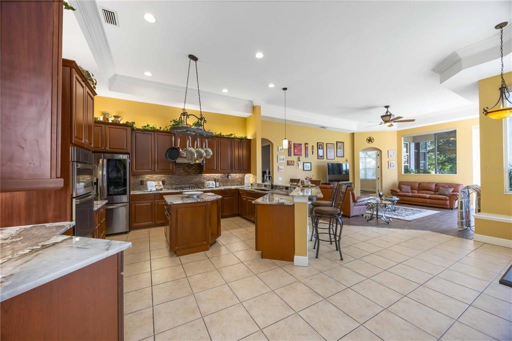 14806 Bowfin Terrace Lakewood Ranch, FL 34202 - Photo 20 of 95 a kitchen with a sink counter top space and appliances