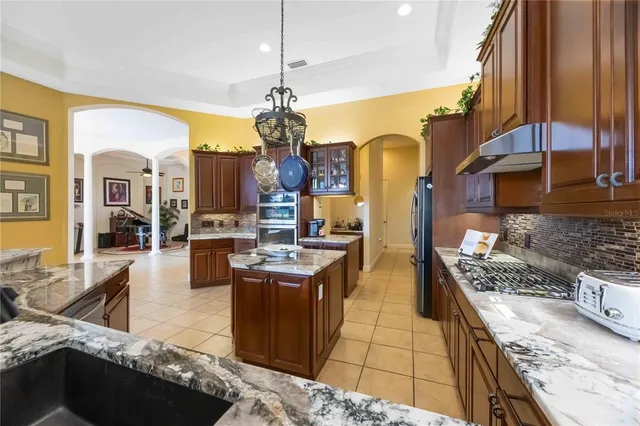 a bathroom with a double vanity sink toilet and shower