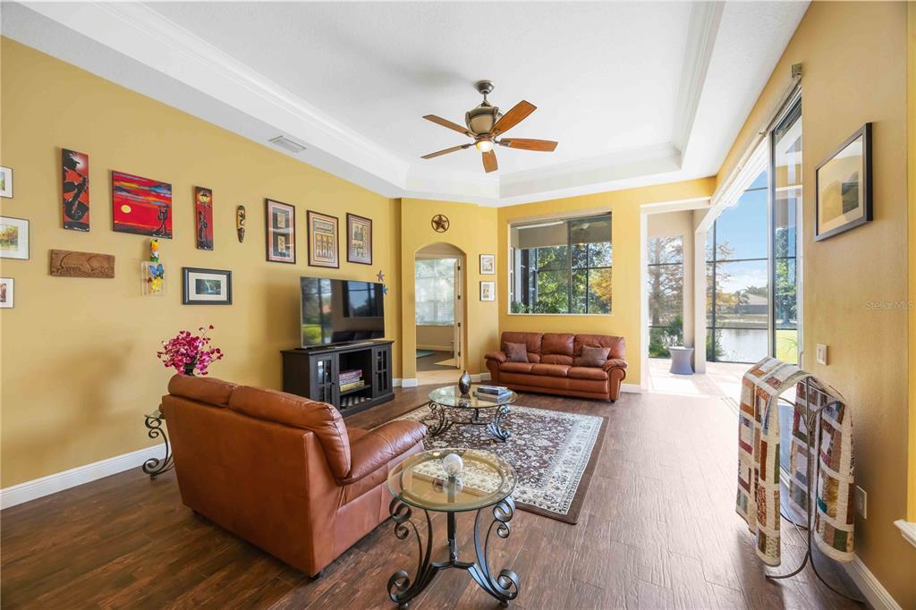 14806 Bowfin Terrace Lakewood Ranch, FL 34202 - Photo 30 of 95 a living room with furniture fireplace and flat screen tv