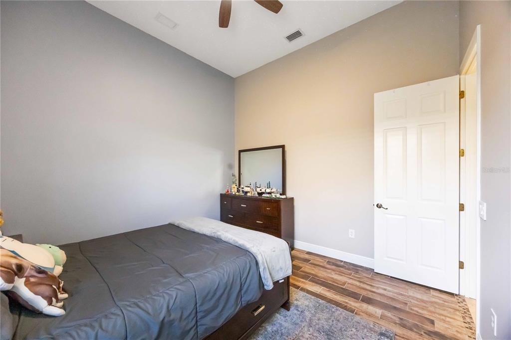 14806 Bowfin Terrace Lakewood Ranch, FL 34202 - Photo 42 of 95 a bedroom with a bed and a window