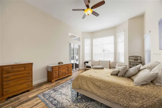 an aerial view of a house with a yard and lake view