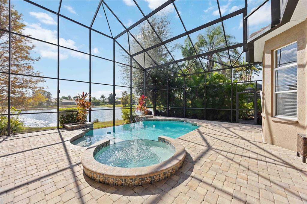 14806 Bowfin Terrace Lakewood Ranch, FL 34202 - Photo 79 of 95 a view of a swimming pool with a lounge chairs