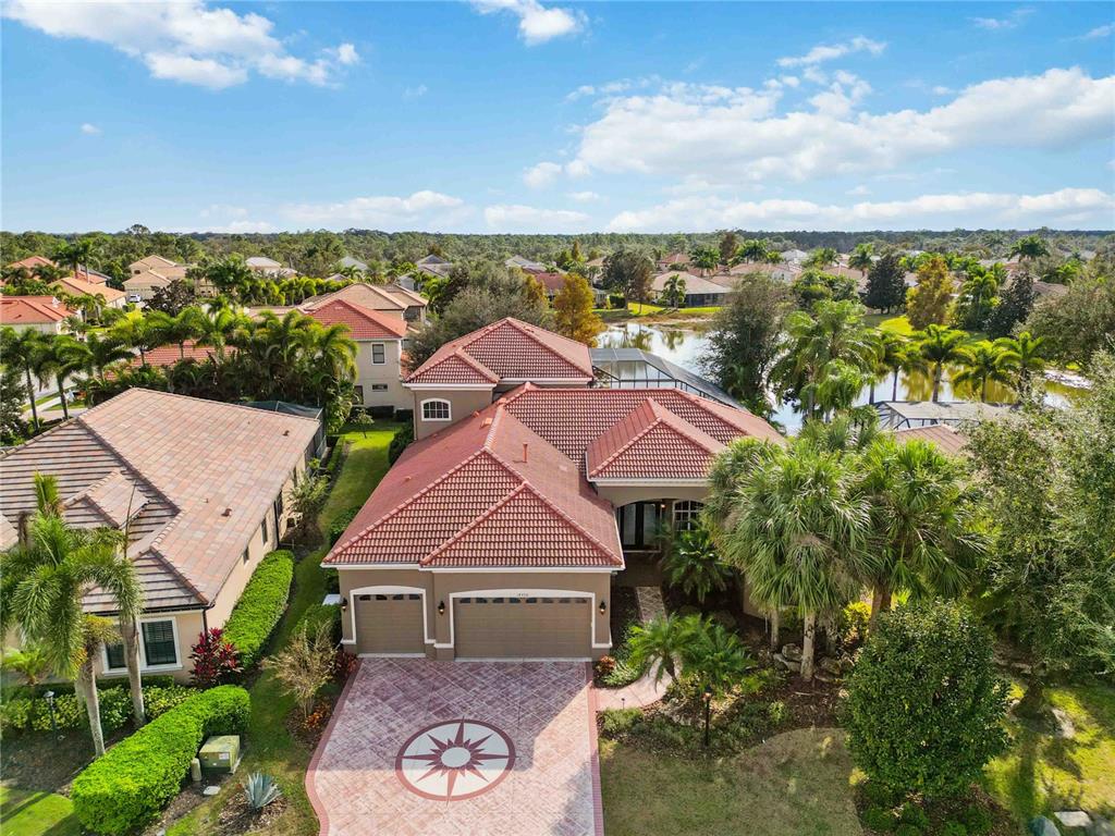 14806 Bowfin Terrace Lakewood Ranch, FL 34202 - Photo 82 of 95 an aerial view of residential houses with outdoor space and trees