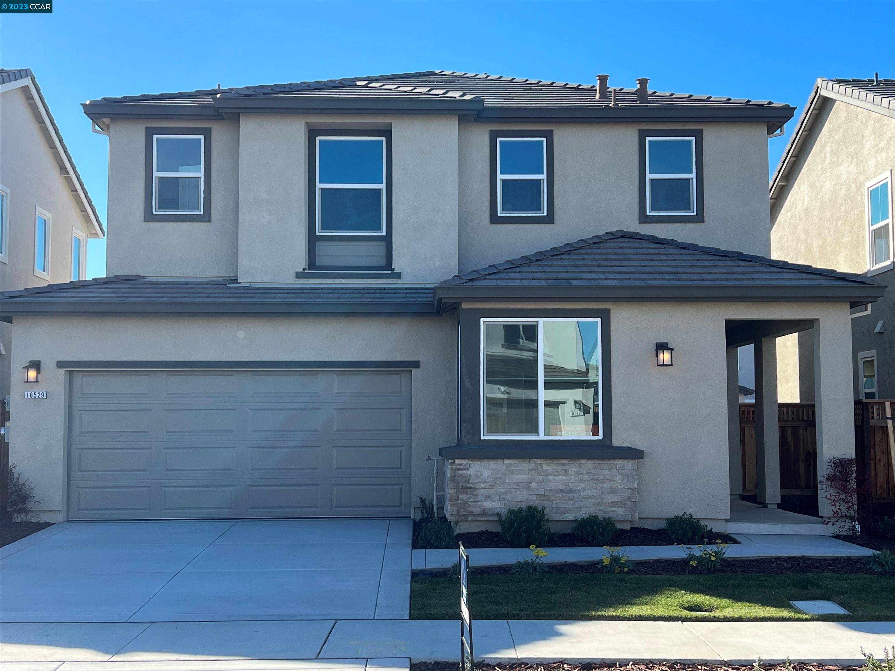 a front view of a house with glass windows