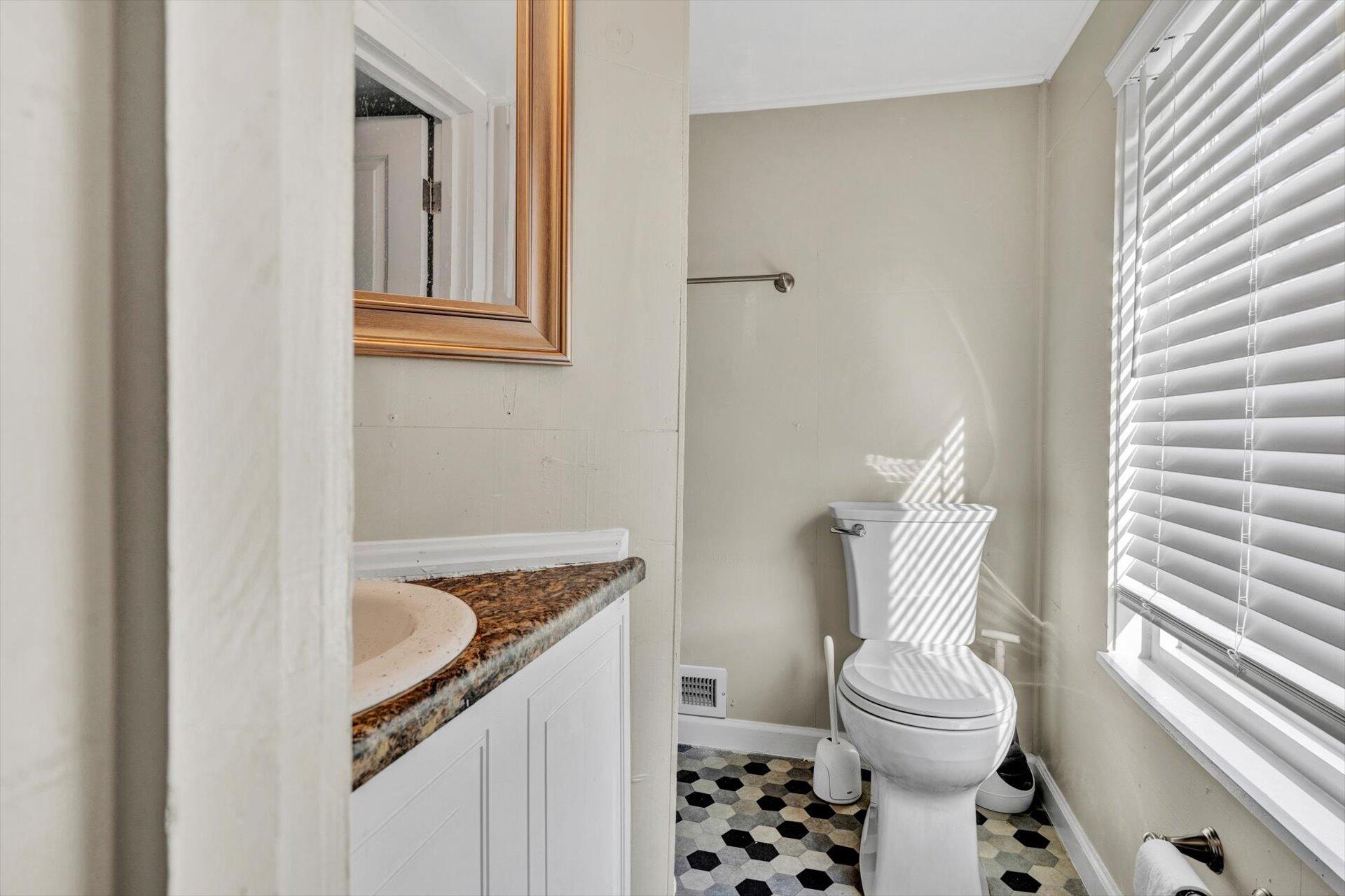 3718 Keagy Road Southwest Roanoke, VA 24018 - Photo 18 of 22 a bathroom with a sink toilet and shower