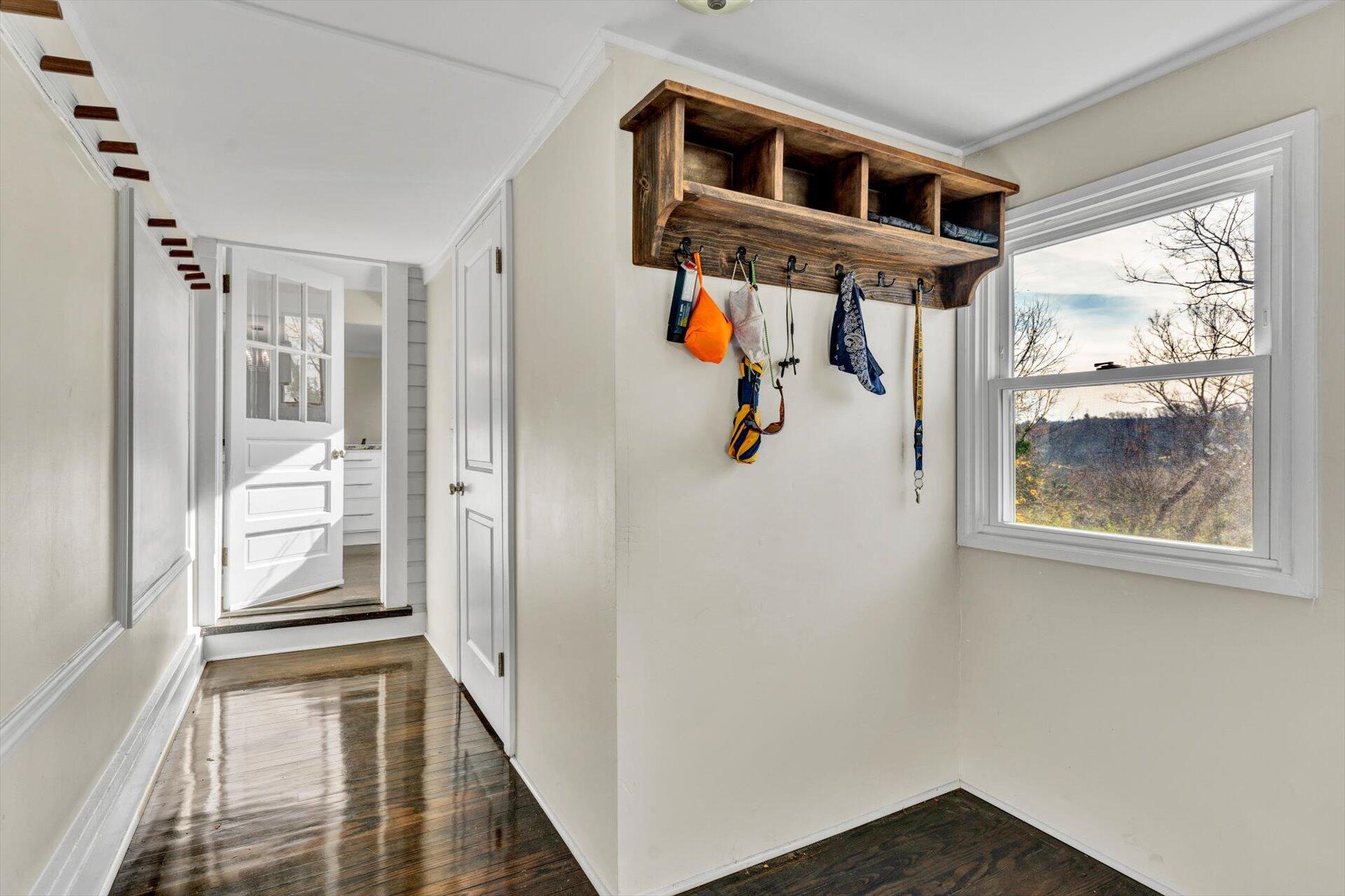 3718 Keagy Road Southwest Roanoke, VA 24018 - Photo 9 of 22 a view of a hallway with wooden floor and windows