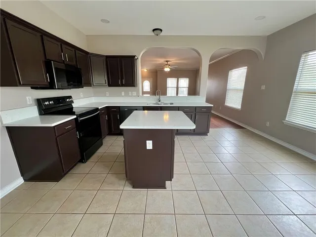 a view of a backyard with a garden and plants