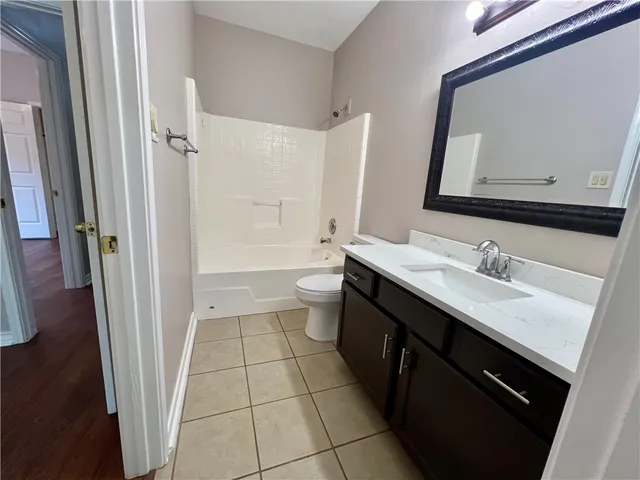 a bathroom with a double vanity sink and mirror