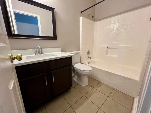 a bathroom with a sink toilet a mirror and shower