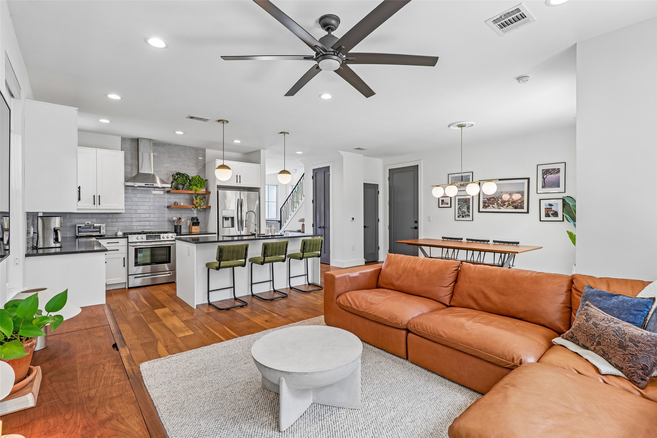 1706 Perez Street, Unit 1 Austin, TX 78721 - Photo 7 of 36 An open-concept design seamlessly connects the sleek kitchen, dining area, and living space.