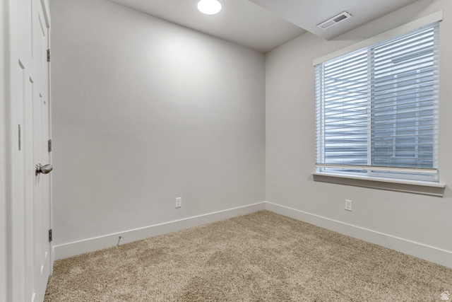 4572 Flower Point Eagle Mountain, UT 84005 - Photo 56 of 62 Neutral-toned carpet flooring and light gray painted walls