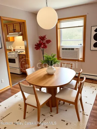 a view of a dining room with furniture and a window