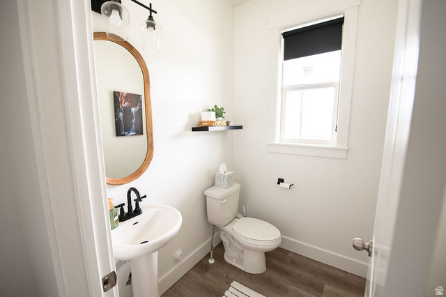 384 Ropelato Drive Nibley, UT 84321 - Photo 16 of 25 Half bath featuring toilet and dark wood-type flooring