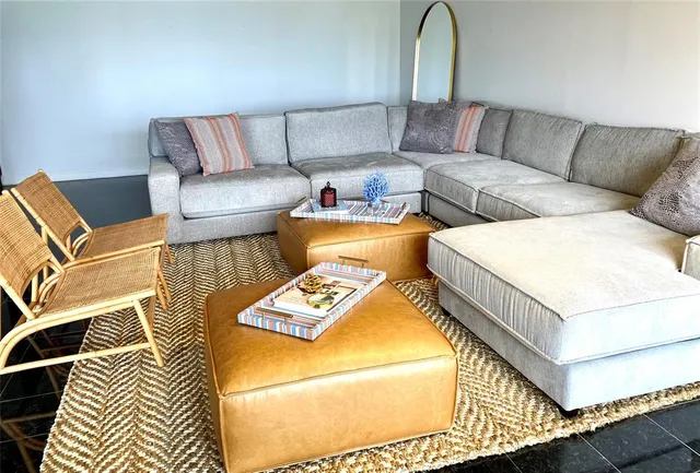 a bedroom with furniture and a chandelier