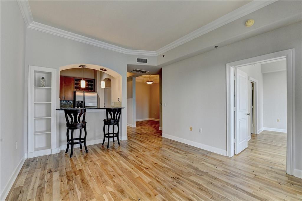 3445 Stratford Road Northeast, Unit 2106 Atlanta, GA 30326 - Photo 11 of 44 a view of a livingroom with wooden floor and furniture
