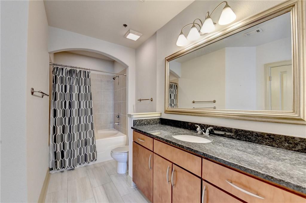 3445 Stratford Road Northeast, Unit 2106 Atlanta, GA 30326 - Photo 18 of 44 a bathroom with a sink and a mirror