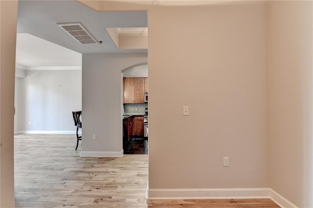 3445 Stratford Road Northeast, Unit 2106 Atlanta, GA 30326 - Photo 19 of 44 a view of empty room with wooden floor