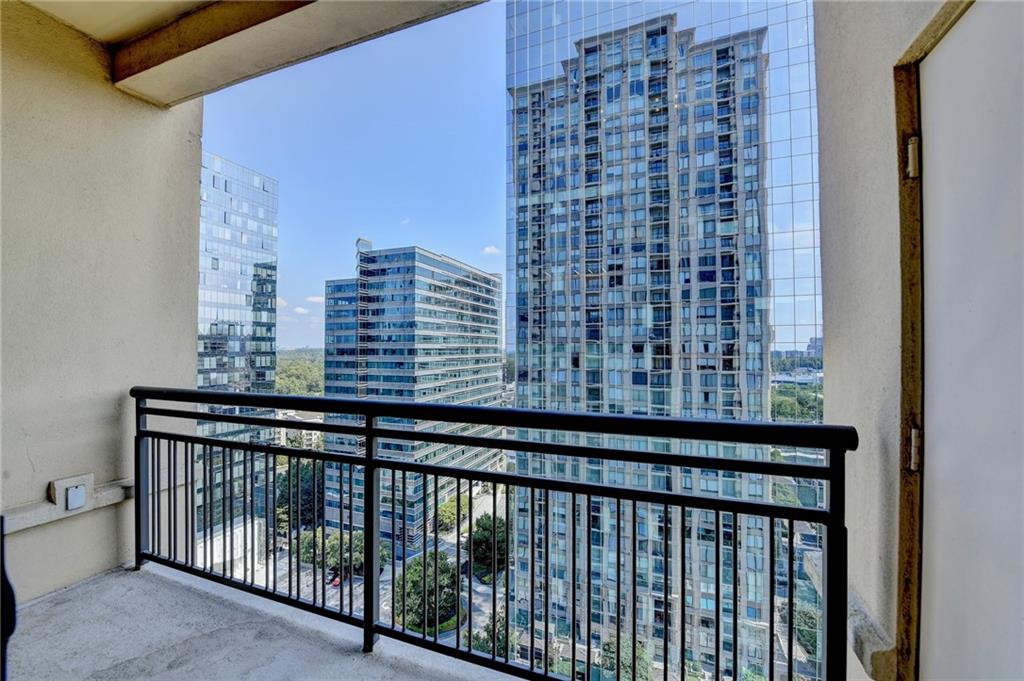 3445 Stratford Road Northeast, Unit 2106 Atlanta, GA 30326 - Photo 24 of 44 a view of a balcony with a bench