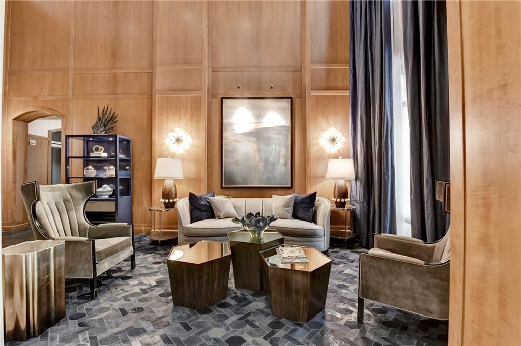 3445 Stratford Road Northeast, Unit 2106 Atlanta, GA 30326 - Photo 25 of 44 a living room with furniture a rug and a window