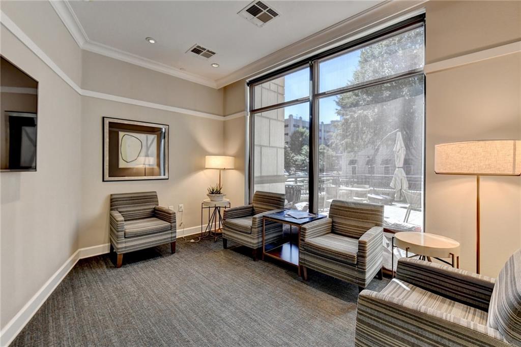 3445 Stratford Road Northeast, Unit 2106 Atlanta, GA 30326 - Photo 32 of 44 a living room with furniture and a window