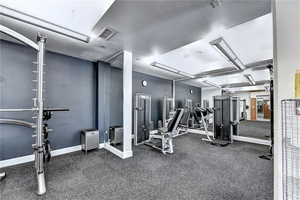 3445 Stratford Road Northeast, Unit 2106 Atlanta, GA 30326 - Photo 38 of 44 a view of a room with gym equipment