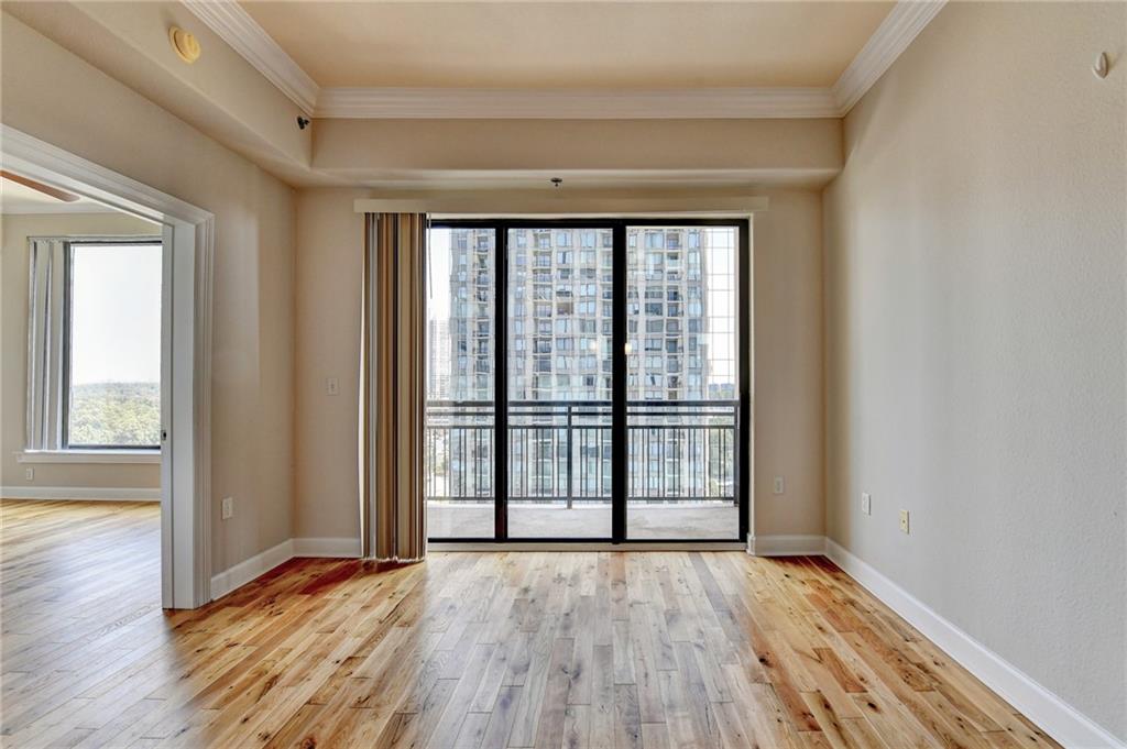 3445 Stratford Road Northeast, Unit 2106 Atlanta, GA 30326 - Photo 9 of 44 wooden floor in an empty room with a window