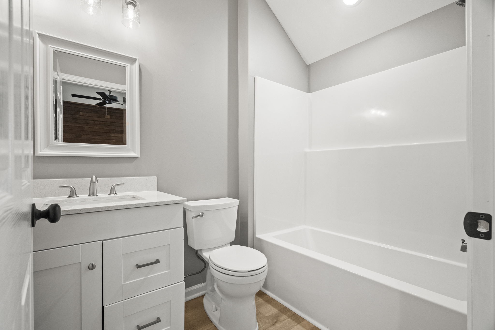 6081 Lakeview Road Springfield, TN 37172 - Photo 14 of 41 a bathroom with a toilet sink vanity tub and mirror