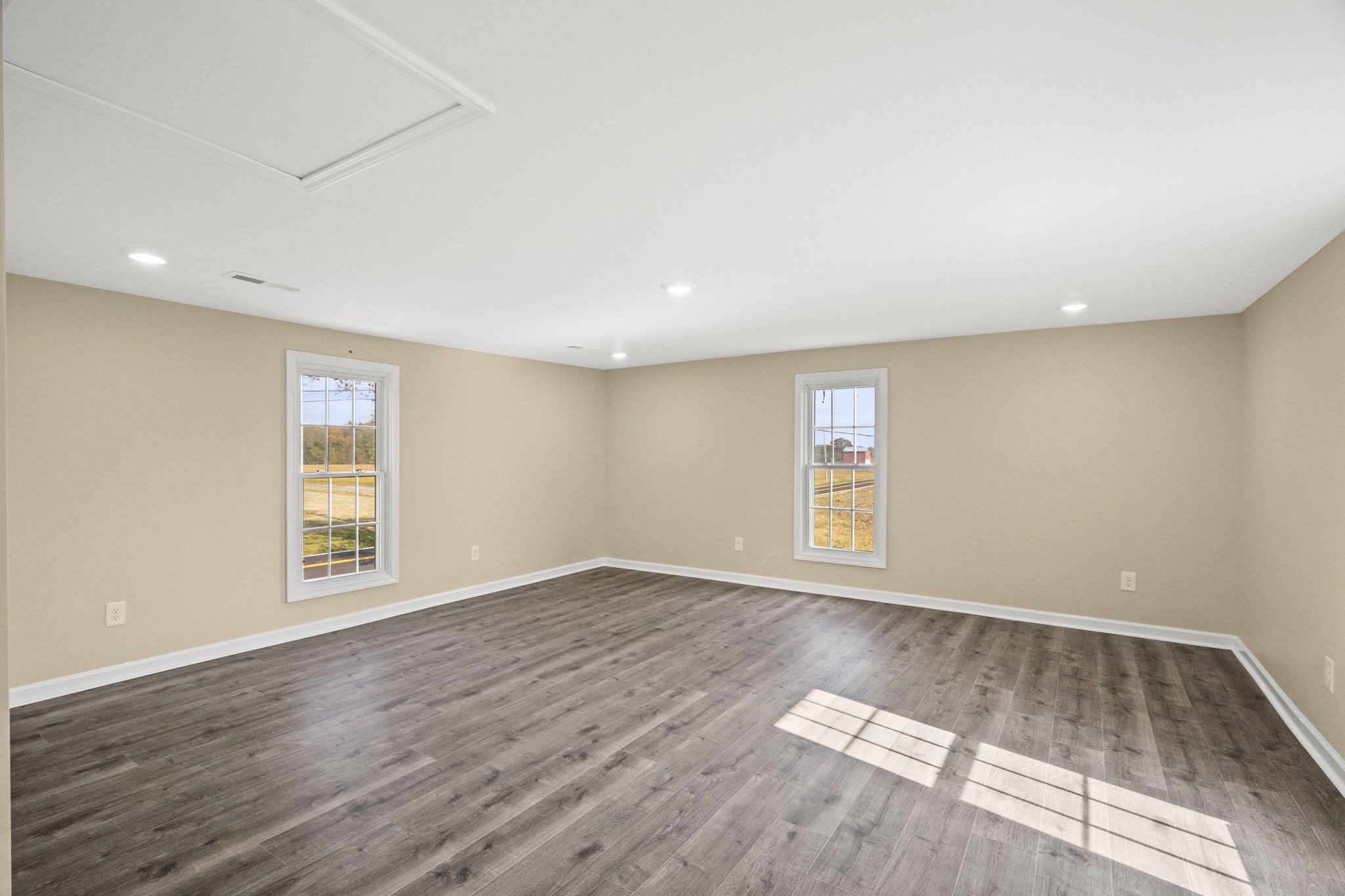6081 Lakeview Road Springfield, TN 37172 - Photo 19 of 41 a view of an empty room with wooden floor and window