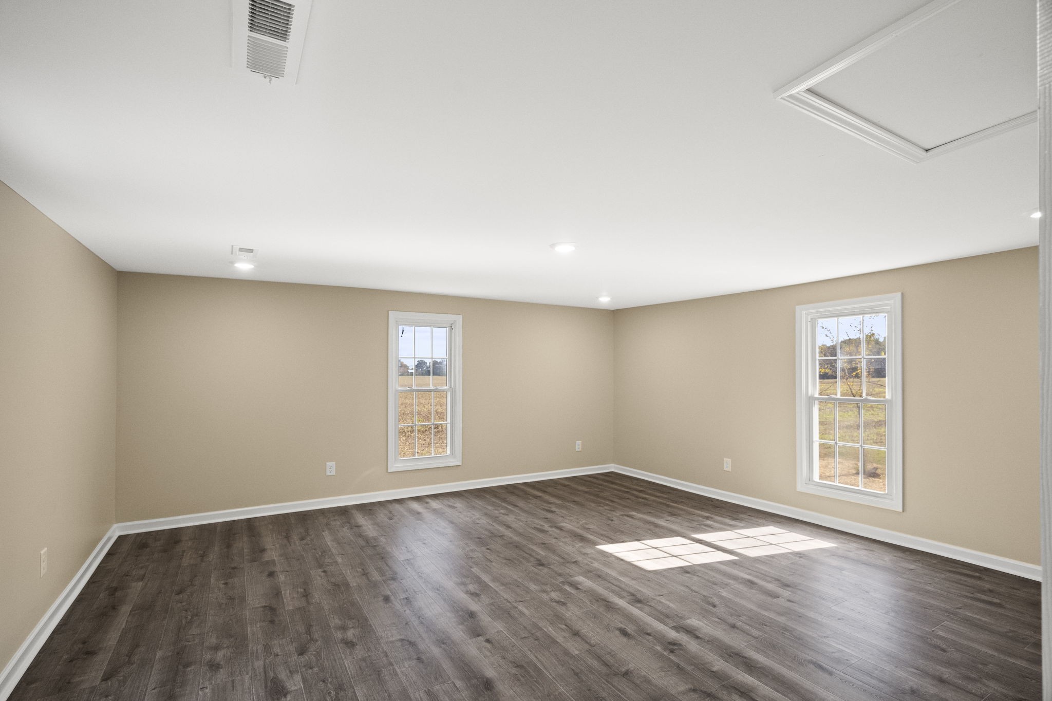 6081 Lakeview Road Springfield, TN 37172 - Photo 21 of 41 an empty room with wooden floor and windows