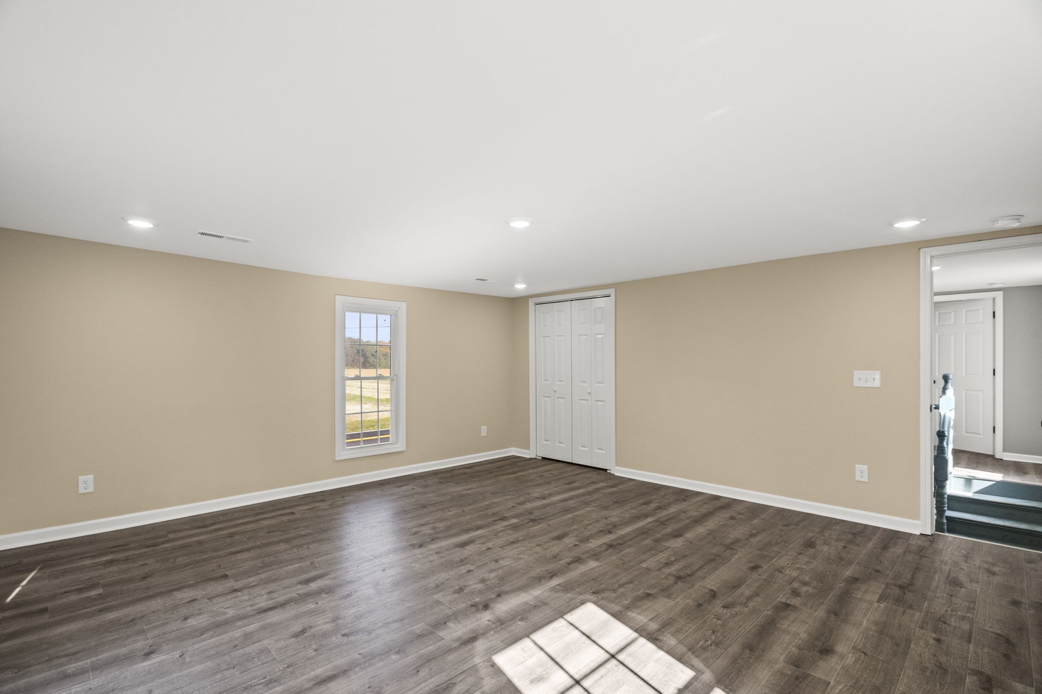 6081 Lakeview Road Springfield, TN 37172 - Photo 25 of 41 a view of an empty room with wooden floor and window