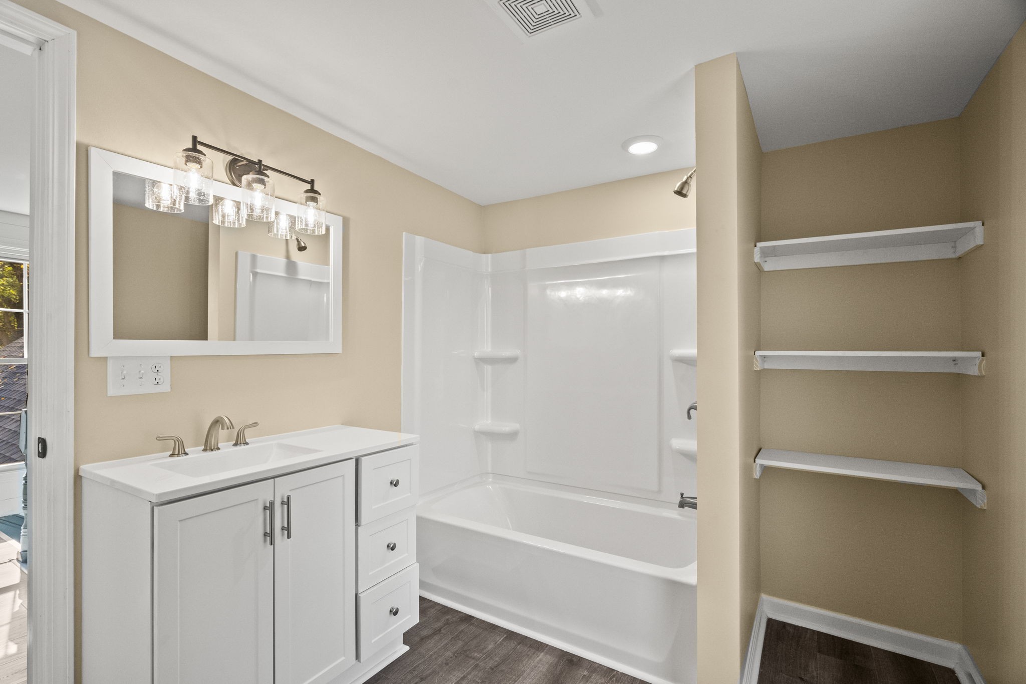 6081 Lakeview Road Springfield, TN 37172 - Photo 27 of 41 a bathroom with a tub sink double vanity and mirror