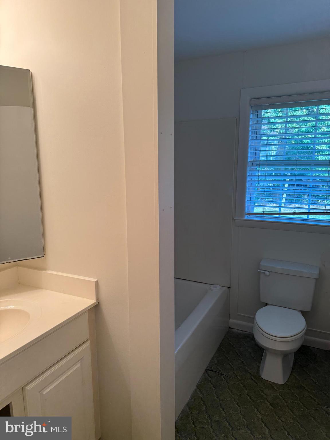 24975 Kruger Road Georgetown, DE 19947 - Photo 17 of 19 a bathroom with a toilet and a sink