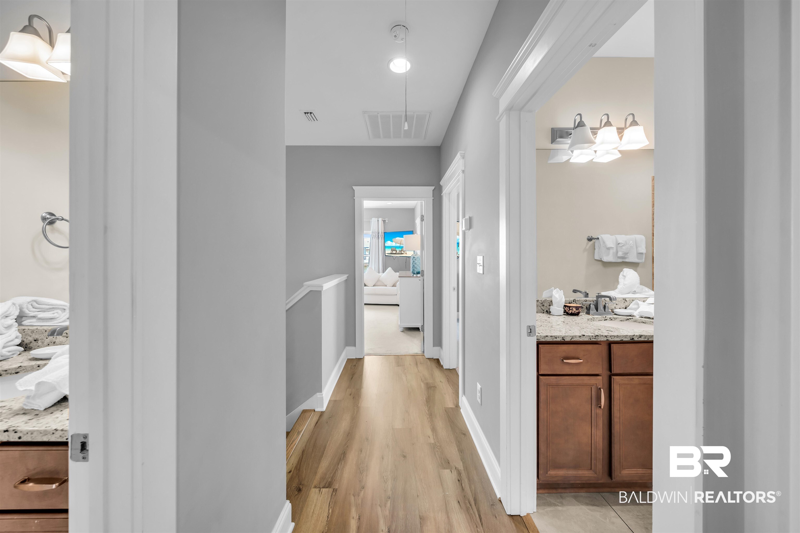 47 Parks Edge Orange Beach, AL 36561 - Photo 32 of 40 Hall with light wood-style flooring, recessed lighting, and an upstairs landing