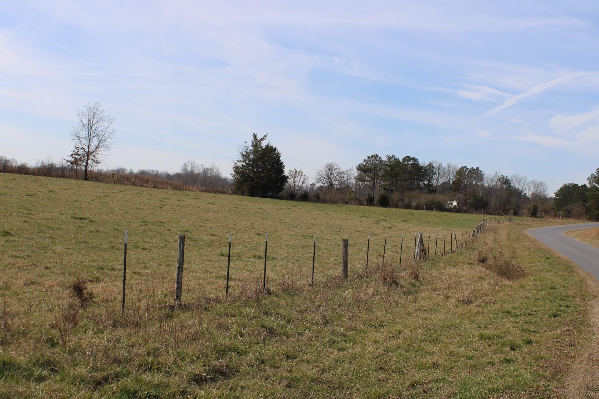 9-10 Ratchford Farm Road Gastonia, NC 28056 - Photo 17 of 29 a view of a lake with houses in the back