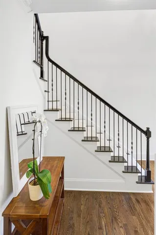 a view of entryway and hall with wooden floor