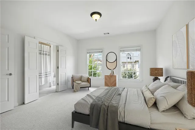 a bedroom with a bed and window