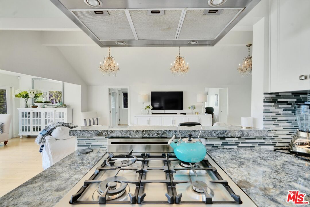 3966 Las Flores Canyon Road Malibu, CA 90265 - Photo 21 of 53 a living room with lots of furniture and a flat screen tv