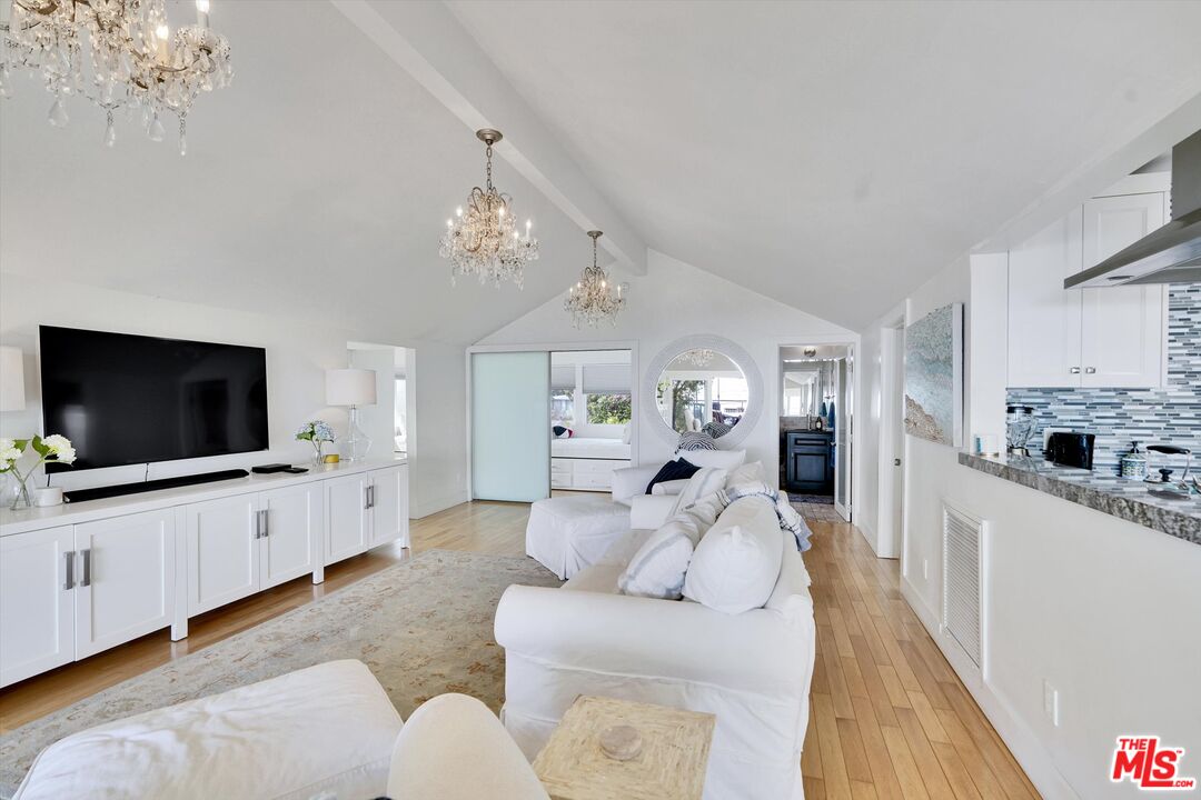 3966 Las Flores Canyon Road Malibu, CA 90265 - Photo 24 of 53 a large living room with furniture and a flat screen tv