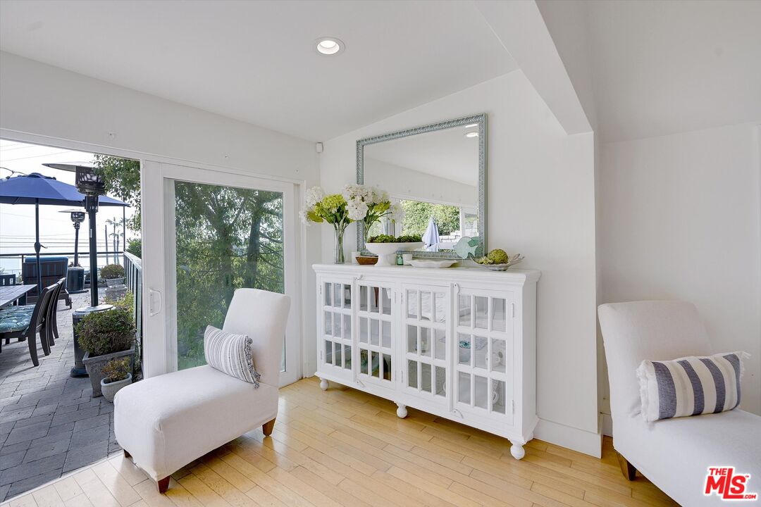 3966 Las Flores Canyon Road Malibu, CA 90265 - Photo 25 of 53 a bedroom with furniture and a large window