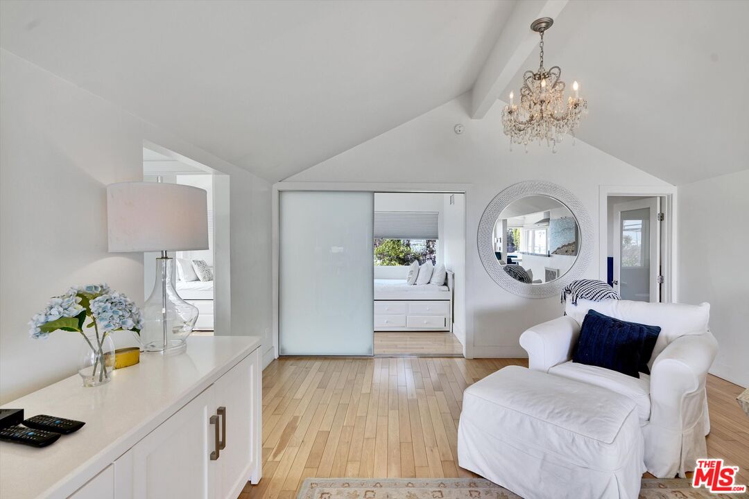 3966 Las Flores Canyon Road Malibu, CA 90265 - Photo 26 of 53 a living room with furniture and a chandelier
