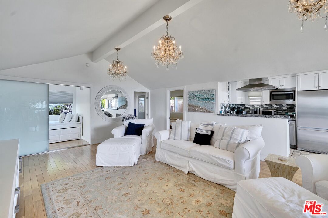 3966 Las Flores Canyon Road Malibu, CA 90265 - Photo 27 of 53 a living room with furniture and a chandelier