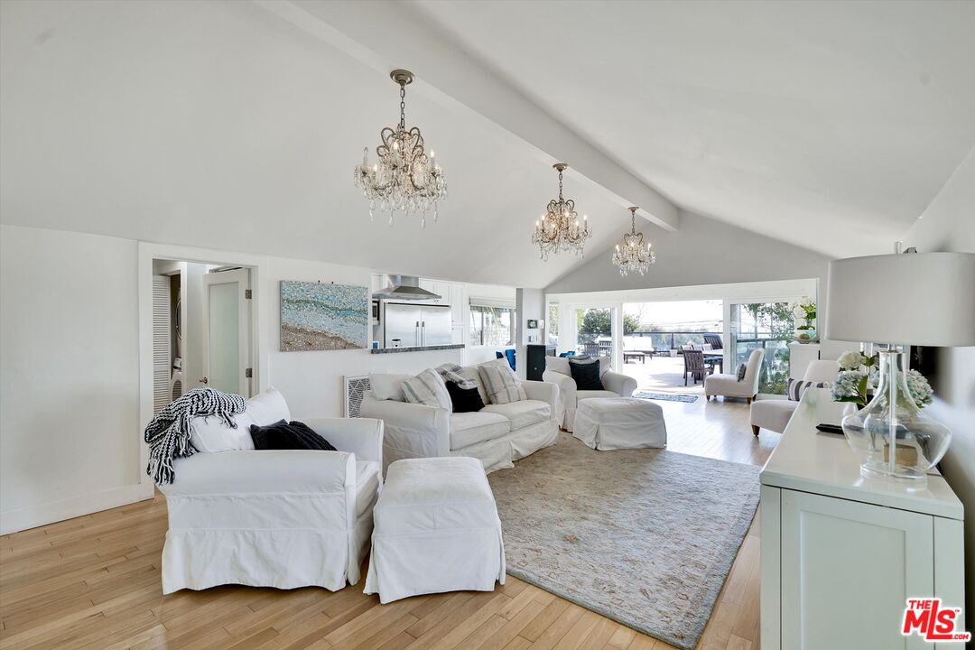 3966 Las Flores Canyon Road Malibu, CA 90265 - Photo 30 of 53 a living room with furniture or chandelier and a wooden floor