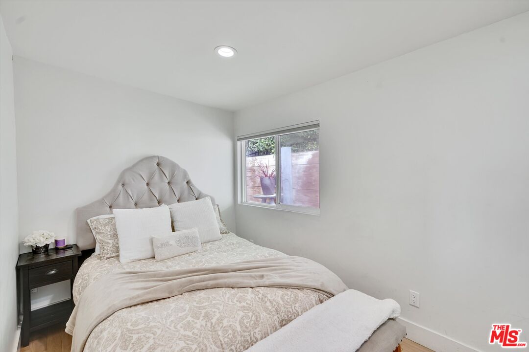 3966 Las Flores Canyon Road Malibu, CA 90265 - Photo 33 of 53 a bedroom with a bed and a window