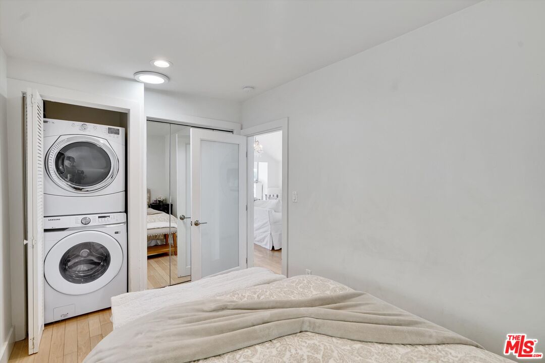 3966 Las Flores Canyon Road Malibu, CA 90265 - Photo 34 of 53 a bedroom with a washing machine and a washer dryer