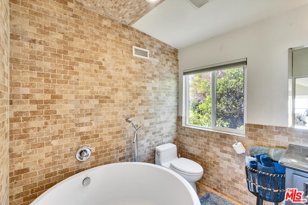 3966 Las Flores Canyon Road Malibu, CA 90265 - Photo 35 of 53 a bathroom with a bathtub and a sink