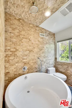 a bathroom with a sink double vanity and a mirror