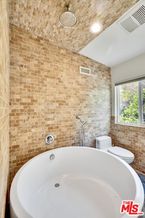3966 Las Flores Canyon Road Malibu, CA 90265 - Photo 36 of 53 a bathroom with a bathtub and shower