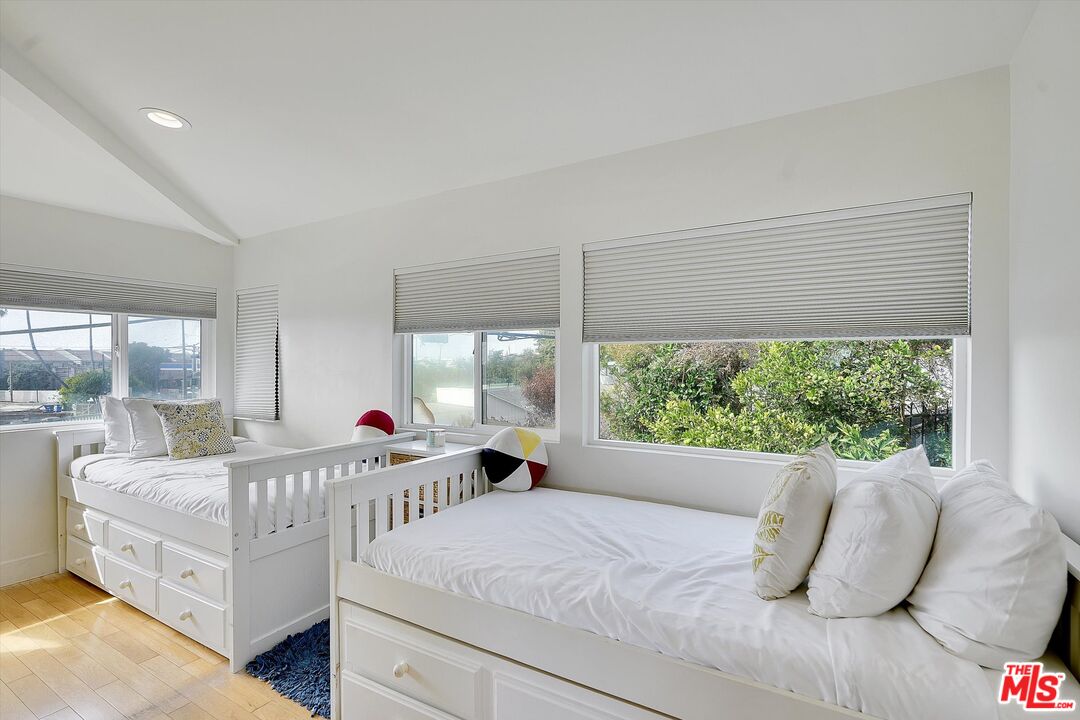 3966 Las Flores Canyon Road Malibu, CA 90265 - Photo 37 of 53 a bedroom with a bed and window